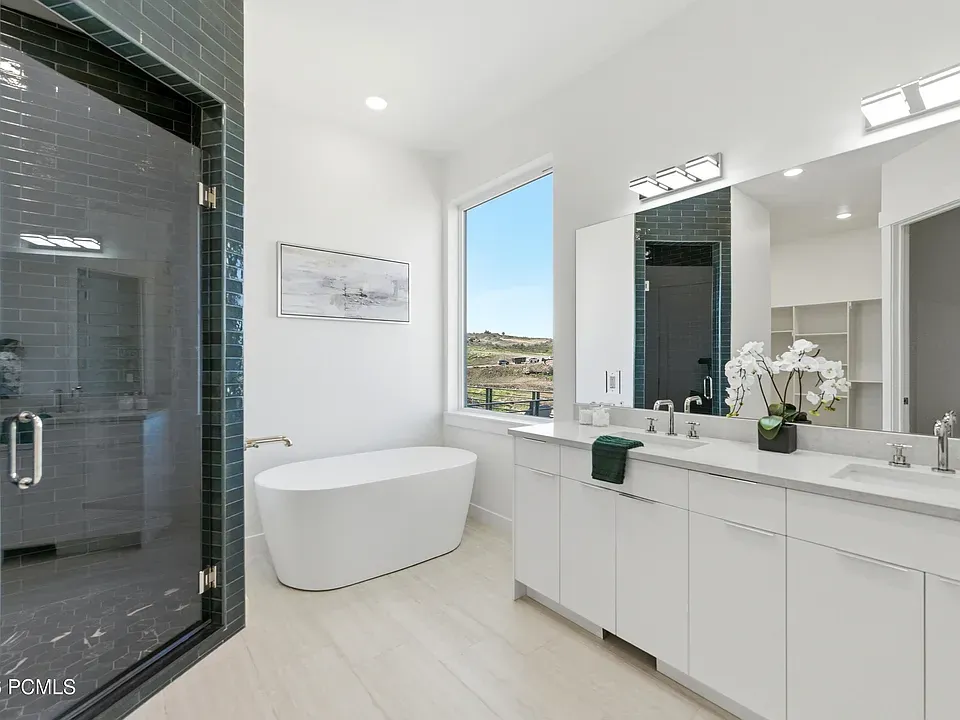 Primary bath with freestanding soaking tub and dual vanity